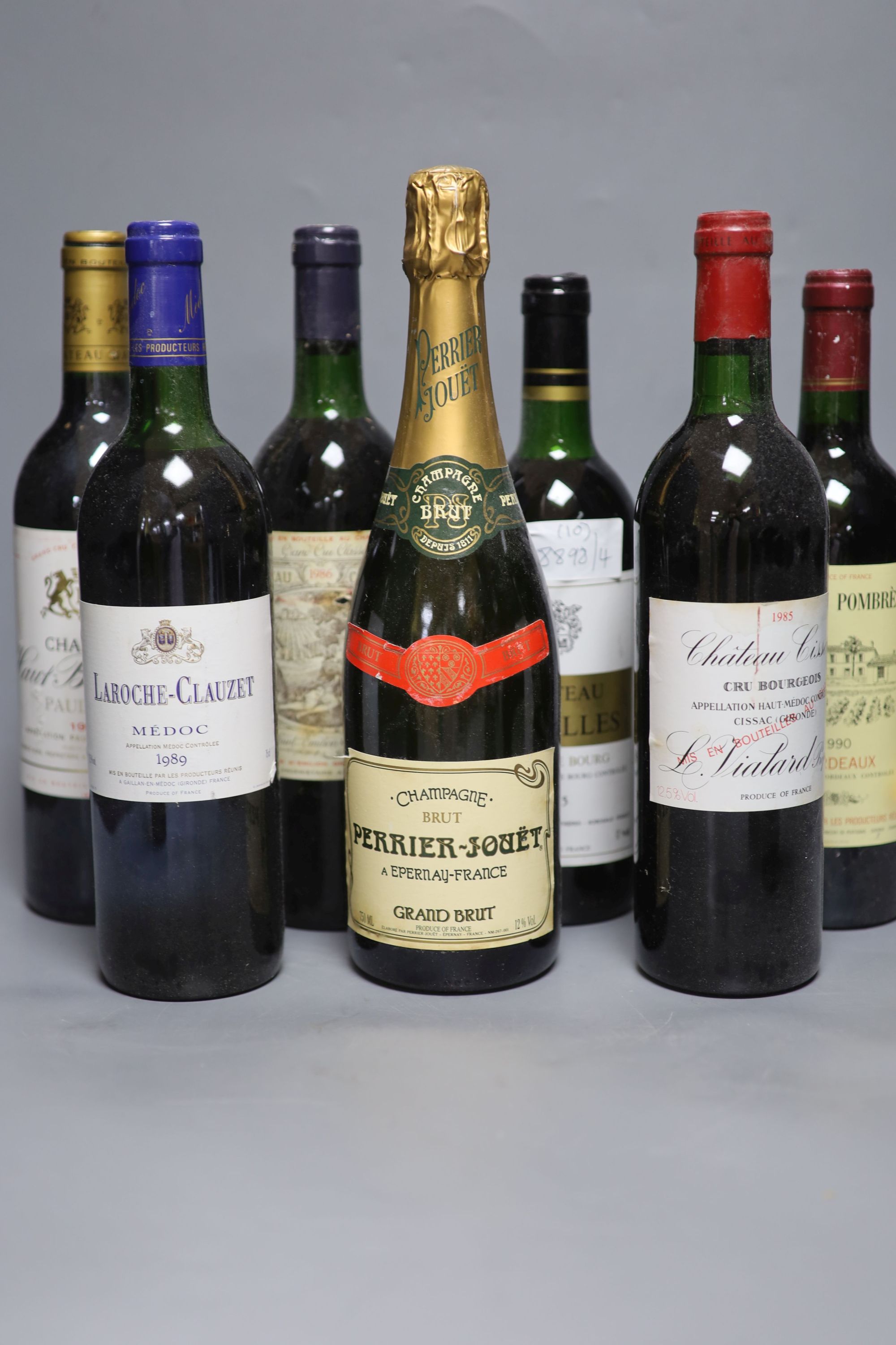 Eight assorted wines including Chateau Batailley 1994, one NV Champagne and one sparkling wine.